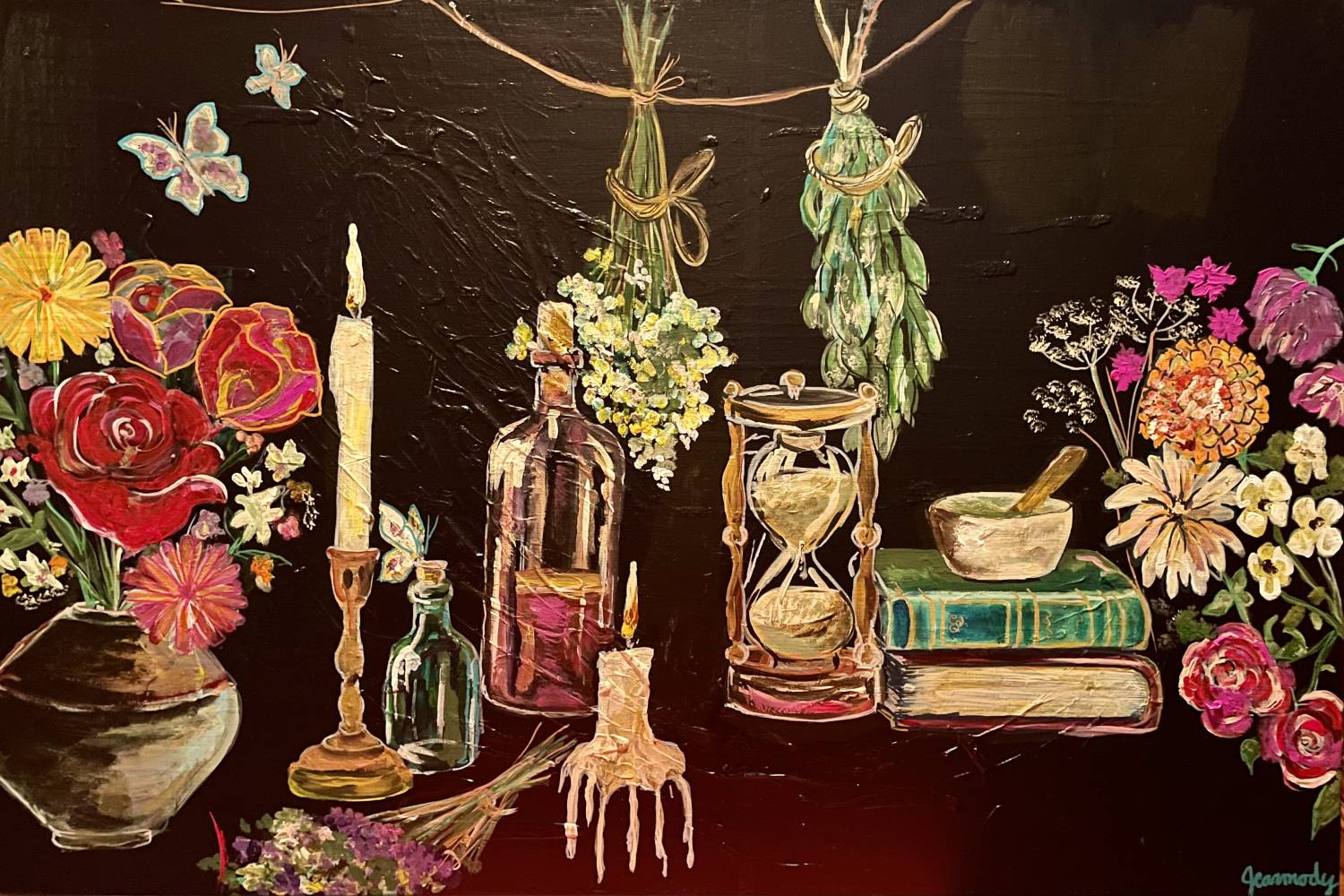 Artist Jacqueline Carmody's piece, "Sarah's Apothecary," which features flowers, candles, bottles, books and an hourglass on a table.