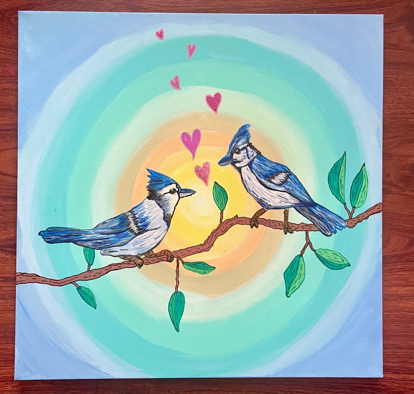 Artist Caryn Frishman's piece, "Two Sisters," which shows two blue jays sitting on a branch together.